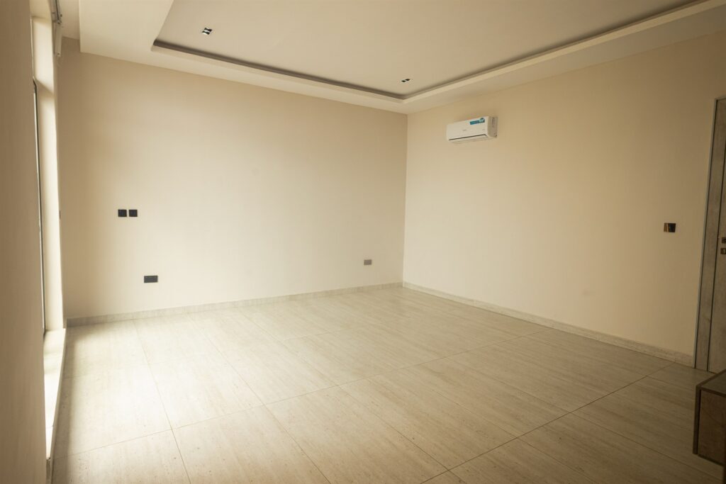 Brum Height 6: Unfurnished bedroom with a recessed ceiling and air conditioner
